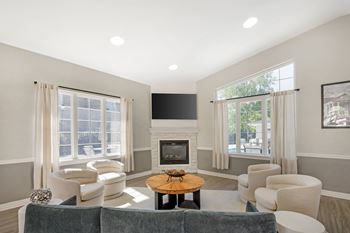Clubhouse lounge with fireplace and curved seating